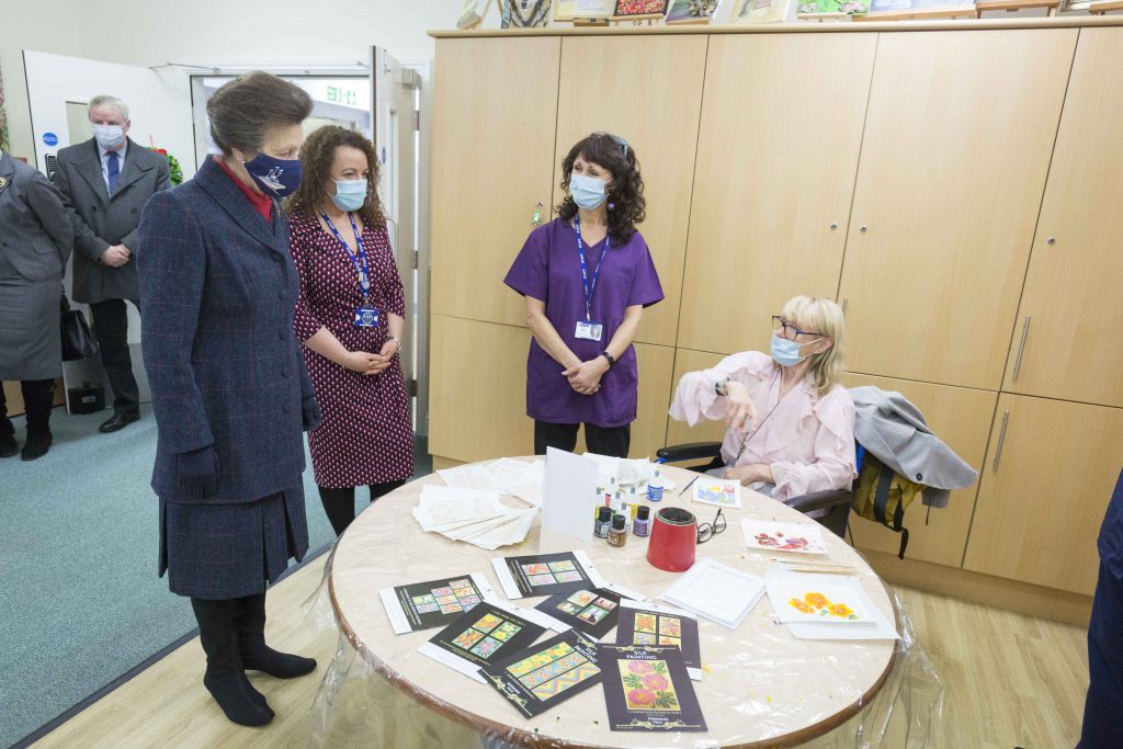 Princess Anne talks to a patient at Saint Ann's Hospice during a visit in December 2021
