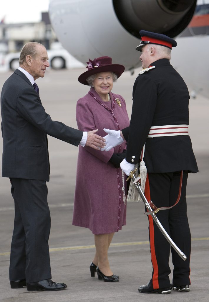 Sir Warren Smith greets The Queen and The Duke of Edinburgh at Manchester Airport