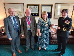 Janet presents a Duchy of Lancaster Benevolent Fund Cheque to the Mayor of Tameside for her charities.