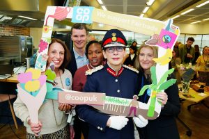 The Lord-Lieutenant poses with a group from the Co-Op in a we support Fairtrade frame